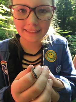 young girl holding snake